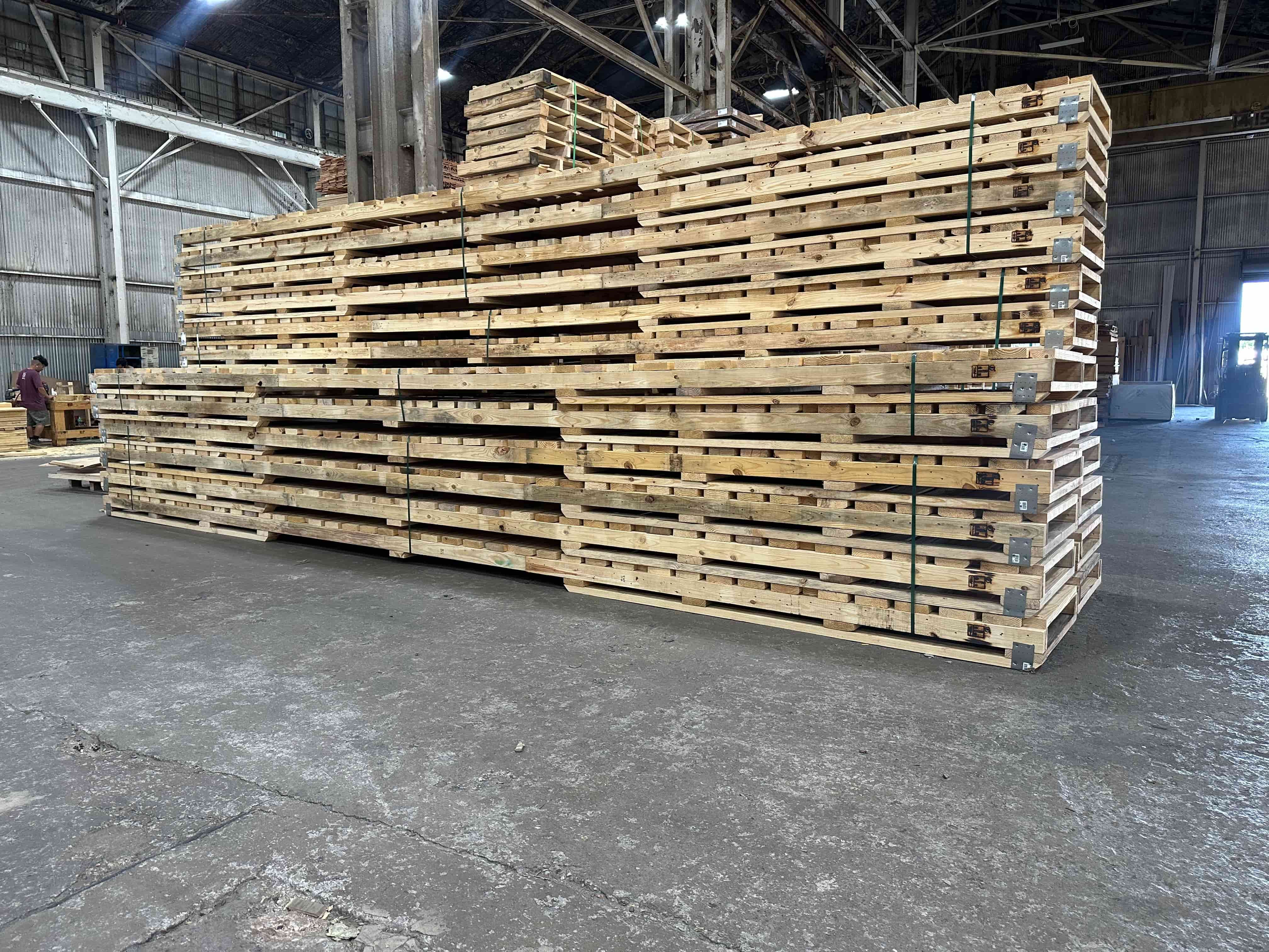 Interior of the Victor Wood Products warehouse, stack of custom pallets