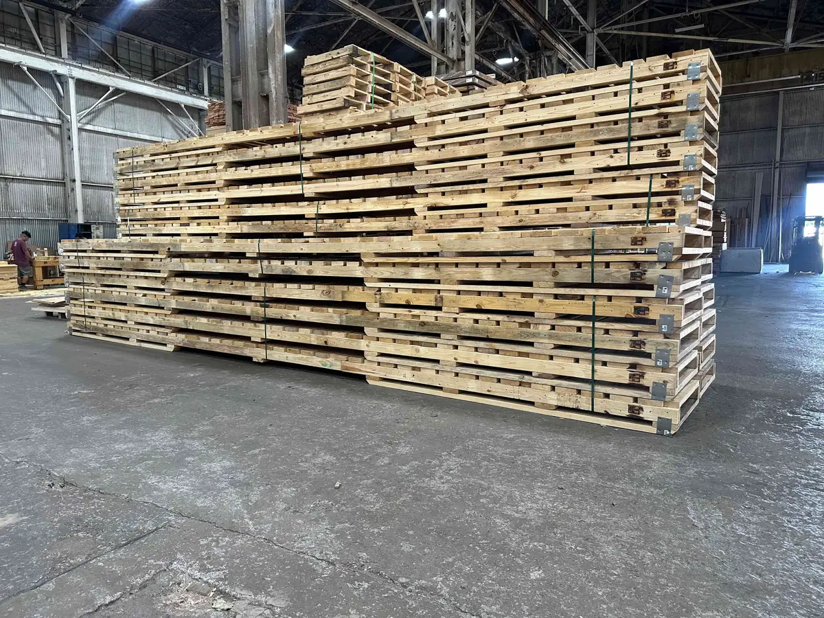 Interior of the Victor Wood Products warehouse, stack of custom pallets