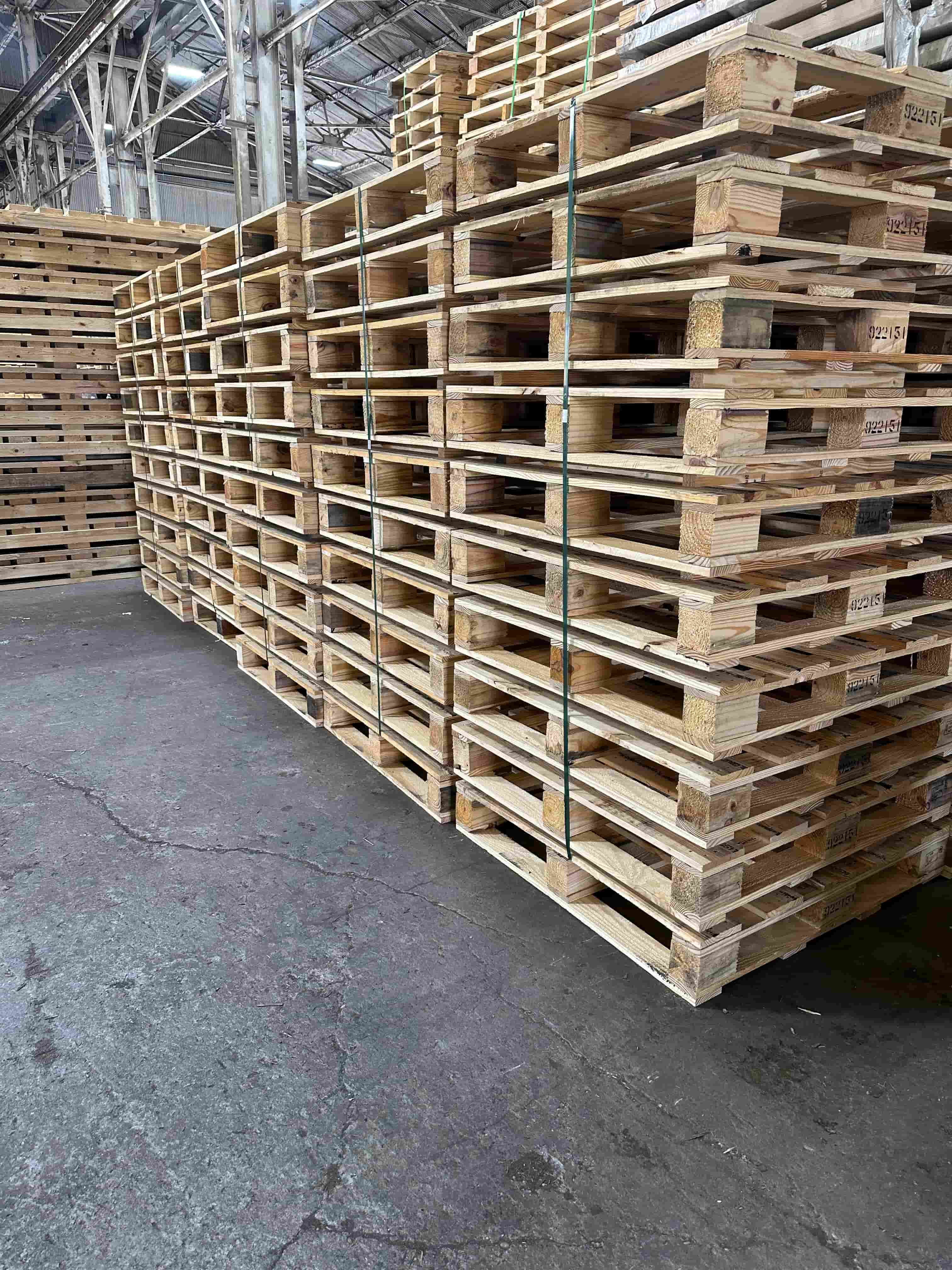 Stacks  wood pallets in the Victor Wood Products workshop
