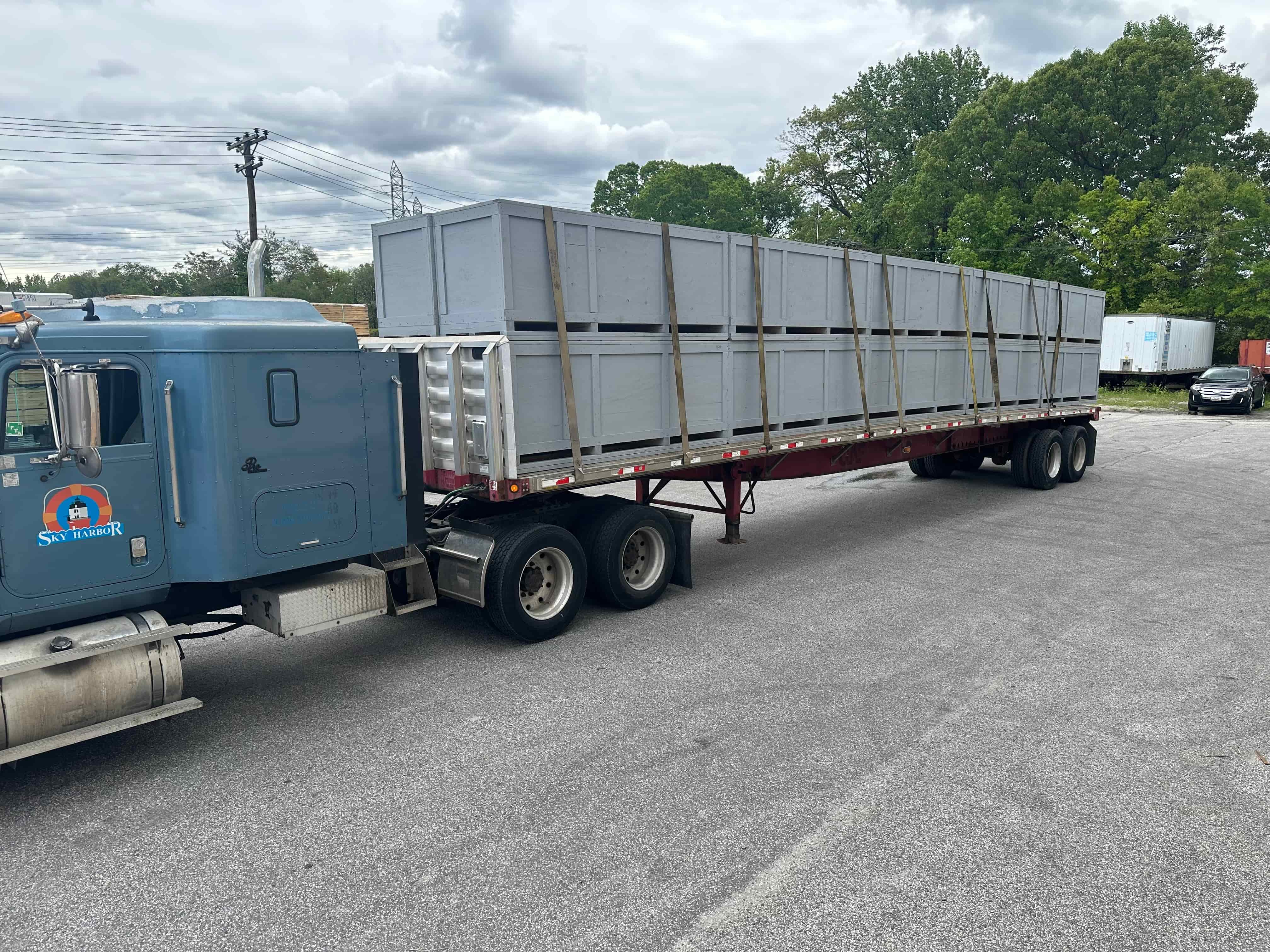 Stock of custom crates loaded on a truck for shipping